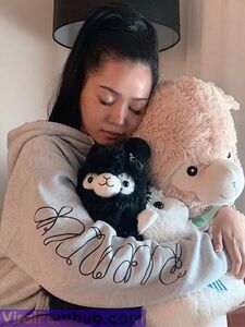 Bella Poarch Hugging her alpacas