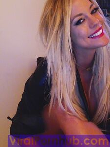 Smiling Blonde Chick Xo Gisele Is Playing With Her Enormous Boobs Before The Camera